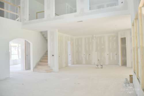 Unfinished Living and Kitchen with drywall,lighting, and plumbing in an open floor plan