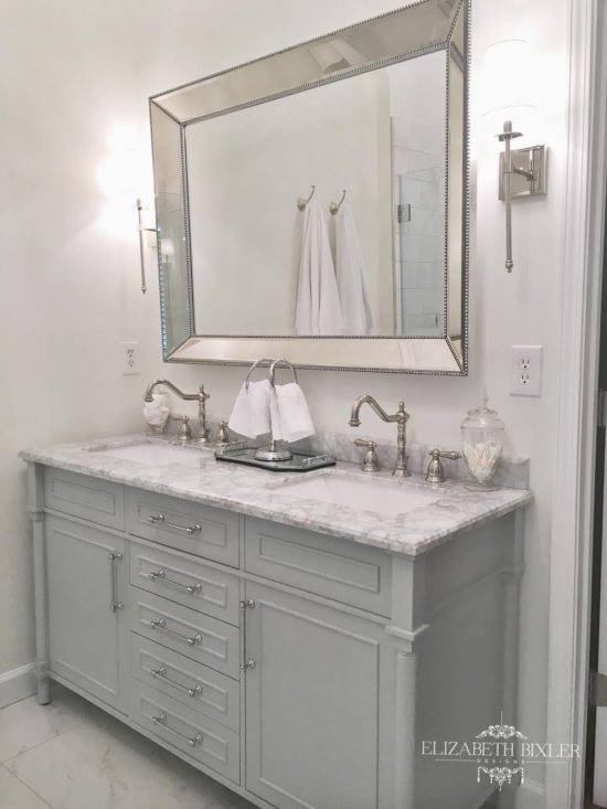 white master bathroom with vintage faucets